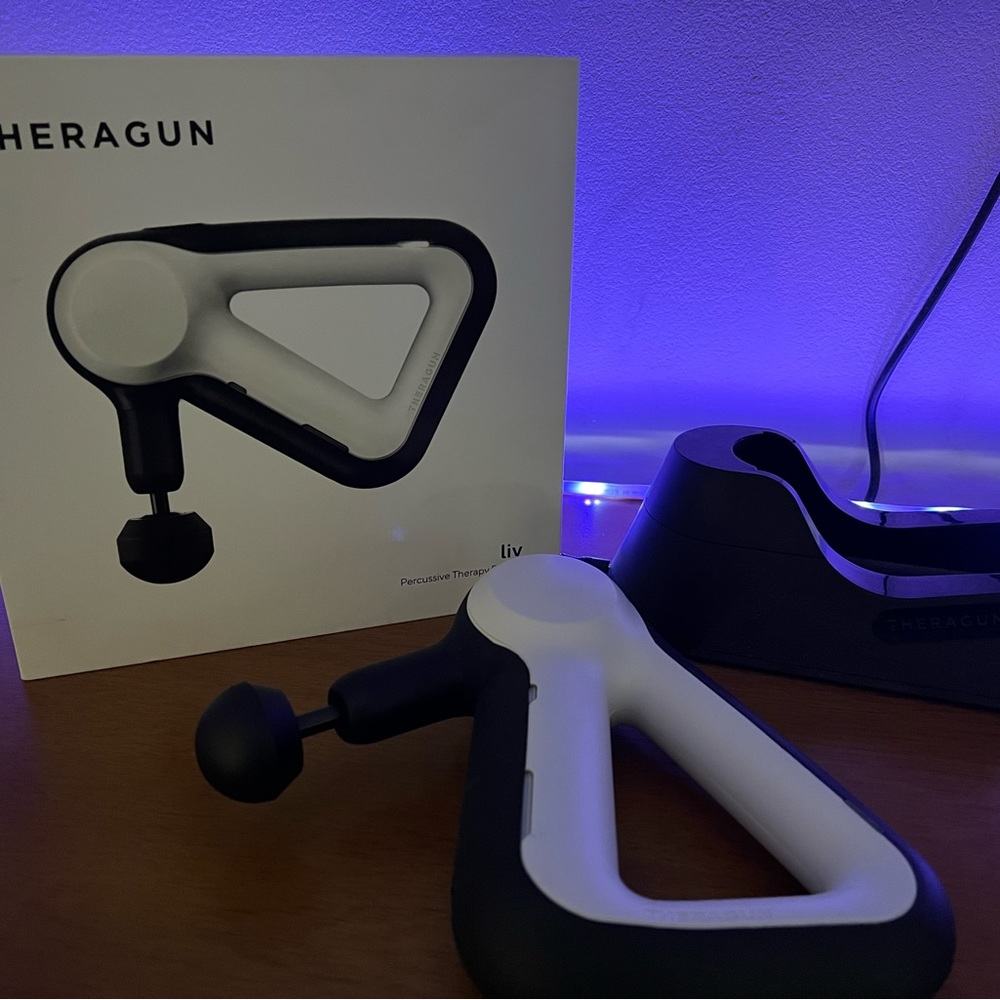 Theragun with charging stand
